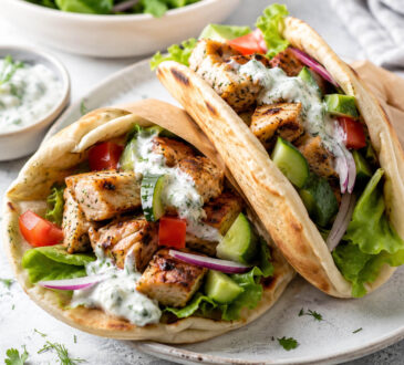 Easy gyro recipe with warm pita, seasoned meat, fresh vegetables, and tzatziki sauce