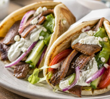Easy beef gyro recipe with seasoned beef, warm pita, fresh vegetables, and tzatziki sauce