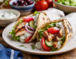 Easy grilled chicken gyros with warm pita, fresh vegetables, and tzatziki sauce